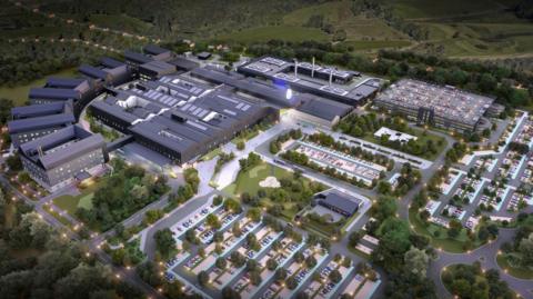An artist's impression of a hospital, with several buildings, parking spaces and green space