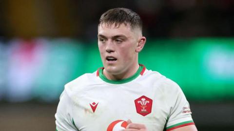 Freddie Thomas stands on the field during Wales' game with South Africa.