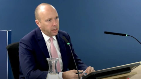 Matt Hancock in a navy suit speaking at the Covid inquiry