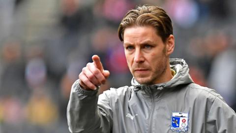 Sam Foley on the touchline during Barrow's League Two fixture at MK Dons recently