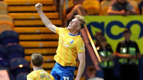 Mansfield Town's Will Evans celebrating against Peterborough