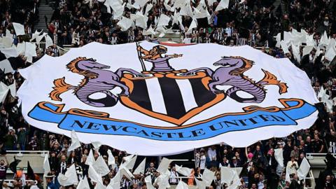 Newcastle United flag in the crowd