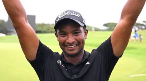 South African golfer Dylan Naidoo celebrates his victory