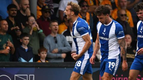 Michael Mellon celebrates scoring for Oldham