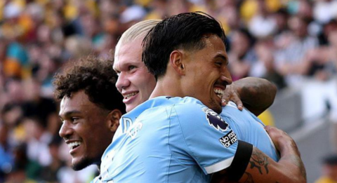 Reijnders celebrates with Erling Haaland for Man City