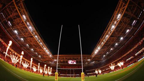An internal shot of the Principality Stadium in the dark with flames shooting up