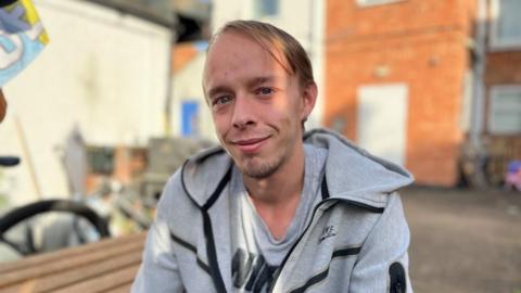 Karl Bowker sitting on a bench