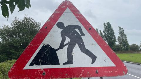 A roadworks warning sign