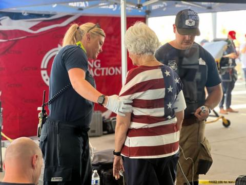 Emergency workers helping a woman in Phoenix Arizona 