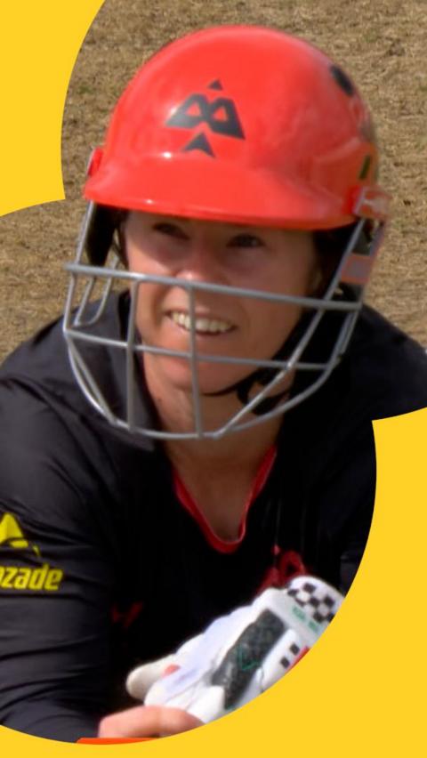 Tammy Beaumont lies in the dirt on the crease after being run out