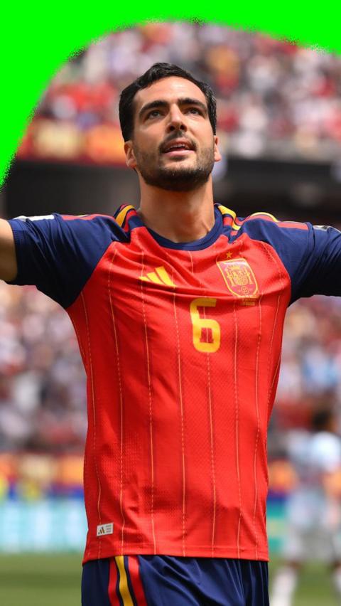 Mikel Merino with his arms wide open as he celebrates a goal for Spain against Belgium in the 2026 World Cup.