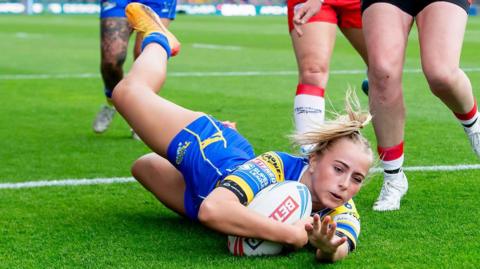 Ruby Walker scores the second of 10 tries for Leeds Rhinos at Headingley