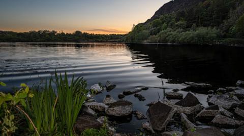 A still loch at sunrise. 