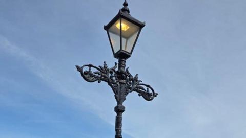 A close up of a black lantern.