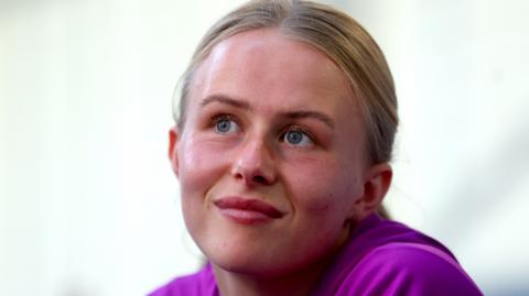 Hannah Hampton smiles during media day