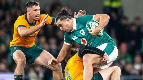 James Lowe is tackled by James O'Connor and Jake Gordon during Ireland's win over Australia last November