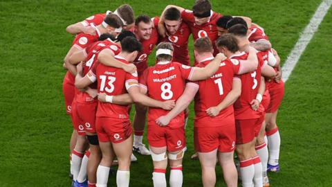 Wales players in a huddle