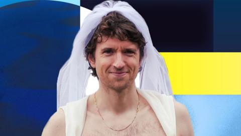Greg James wearing a wedding dress