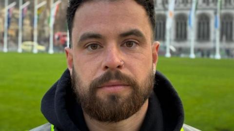 Dom Edington outside Parliament