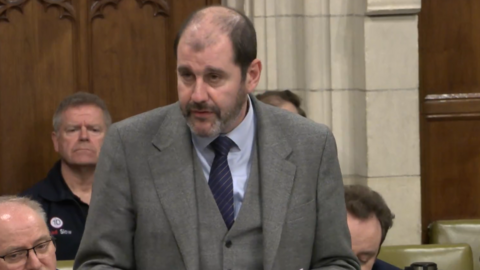 Lee Dillon standing talking at a debate in Westminster Hall