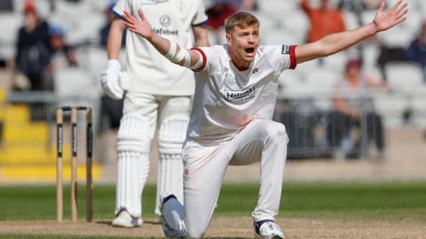 Fast bowler Mitch Stanley appeals for a wicket in action for Lancashire.