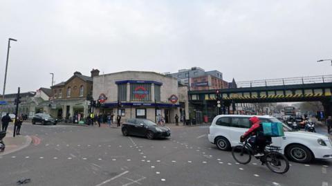 A general view of Balham High Road, showing Balham Underground station and a busy crossroads. 
