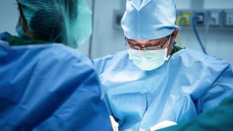 Doctors performing surgery