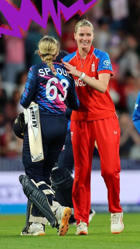 England player pats Scotland's Pippa Sproul on the back 