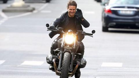 Tom Cruise riding a motorcycle