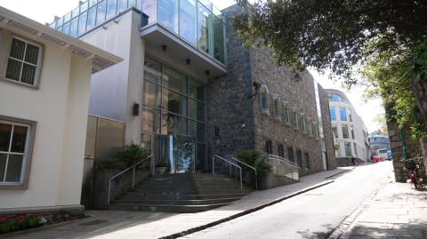 Glass building with granite bricks. 