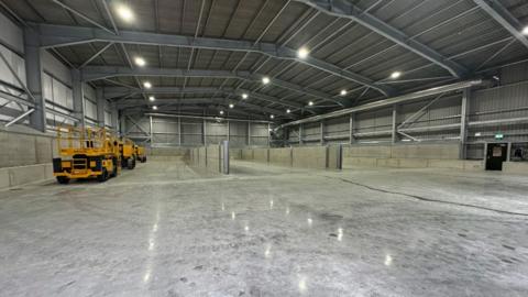 Interior of a large shed, which has been specially built to hold solid and liquid waste