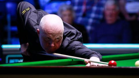 Four-time world snooker champion John Higgins in action