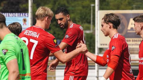 Connah's Quay celebrate Callum West's opener at Ammanford