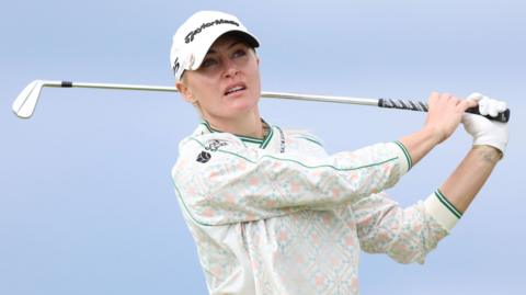 Charley Hull watches her ball after an iron shot