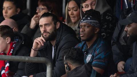 Andy Carroll and YouTuber KSI watch from Dagenham & Redbridge together against Dorking from the stands