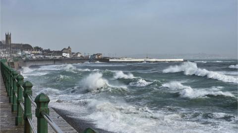 Coastal promenade with a rough sea