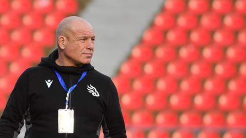 Richard Cockerill watches his Georgia side warm up before a game