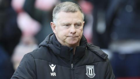 A pensive looking Stoke City boss Mark Robins