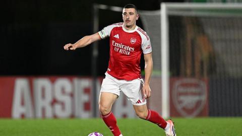 Maldini Kacurri brings the ball out of defence for Arsenal under-21s