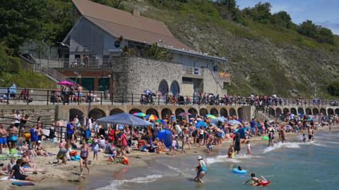 People in the hot weather on Sunny Sands beach in Folkestone