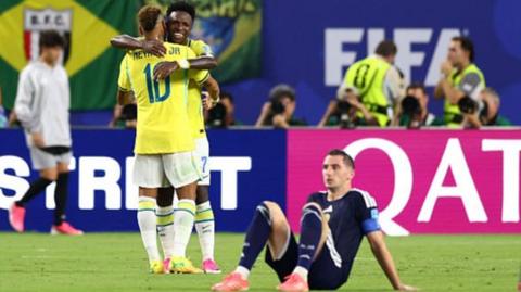 Neymar and Vinicius Jr celebrate victory with a hug as Scotland's players suffer