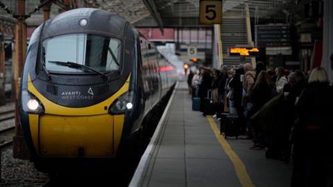 Avanti West Coast train with passengers waiting on a platform number 5