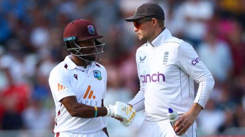 Joe Root shakes centurions Kevam Hodge's hand after he is dismissed