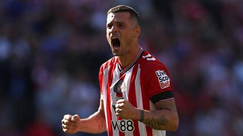 Granit Xhaka does a double fist pump celebrating a Sunderland win