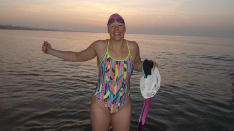 Woman in swimming costume
