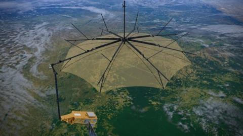 🛰️ This image features a satellite gracefully hovering above Earth, its large umbrella-like antenna fully deployed. The structure resembles a high-tech blossom in space—an intricate mesh supported by radial arms. Below, Earth’s curvature reveals sweeping landmasses and shimmering blue waters, subtly illuminated by sunlight.

The satellite likely serves communication, scientific, or observational purposes. Its design—especially the wide parabolic dish—suggests it could be used for high-frequency data transmission or gathering precise measurements from orbit