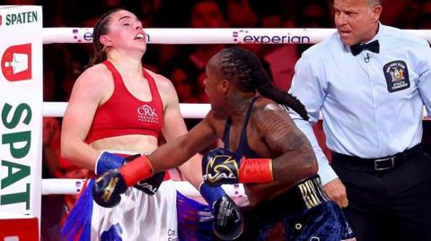 Savannah Marshall's head snaps back as she is punched by Shadasia Green