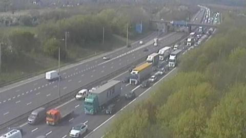M1 Junction 20 is pictured, with queueing traffic on one side of the road