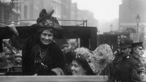 Emmeline Pankhurst climbing out of a car.