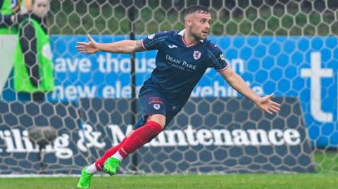 Lewis Vaughan celebrates his goal against Partick Thistle